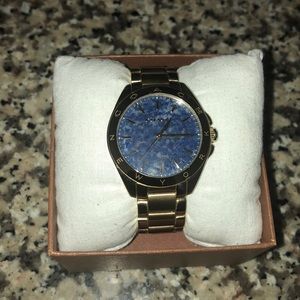 Blue Marble face Gold Coach watch